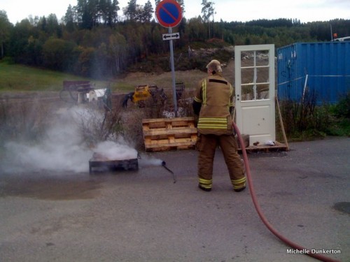 Dousing the fire with broad spray of water