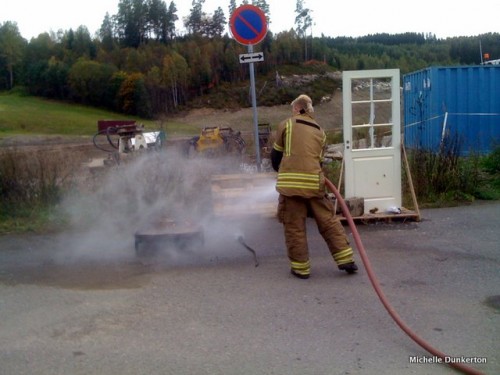 Dousing the fire with broad spray of water
